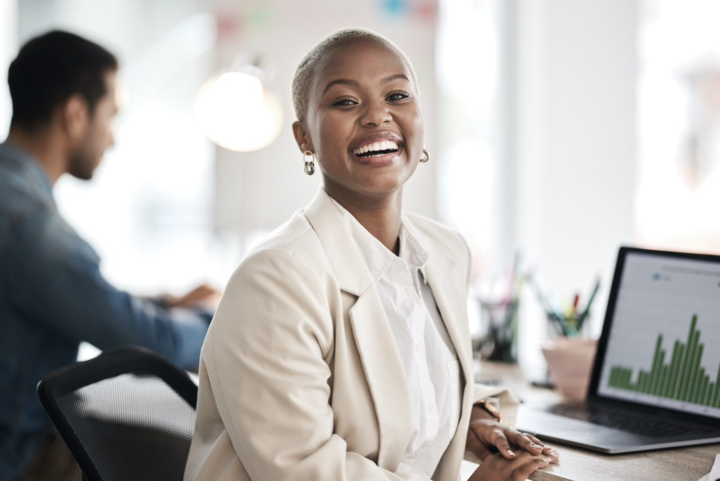 Smiling professional in a bright office conversation